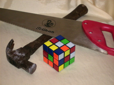 You should use the proper tools when dimantling a rubik's cube.