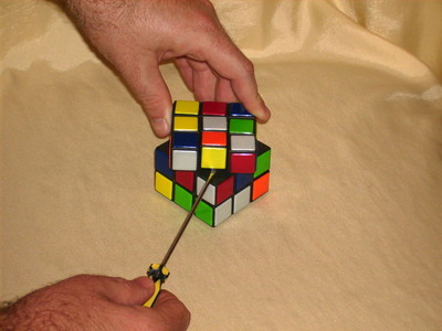 You need a screwriver to dismantle a rubik's cube