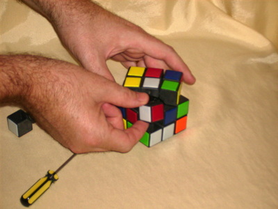Remove one edge piece from the middle layer